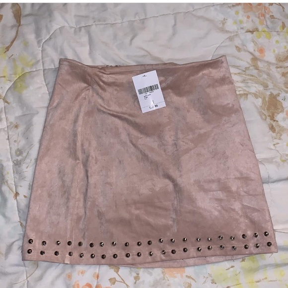 A pinkish cream colored skirt with studs - Picture 1 of 1